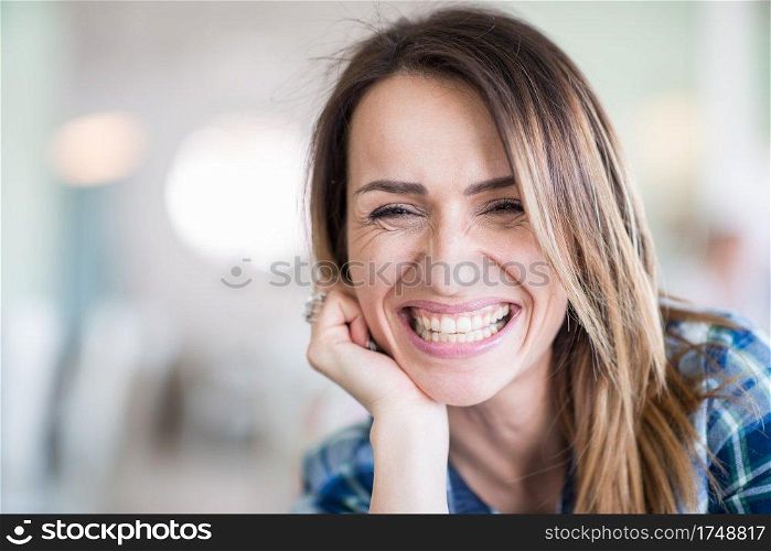 Portrait of cheerful, smiling woman