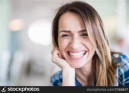 Portrait of cheerful, smiling woman