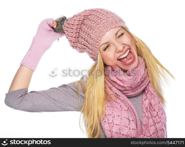 Portrait of cheerful teenager girl in winter hat and scarf