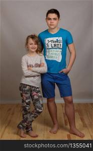 Portrait of cheerful young brother and little sister