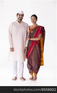 Portrait of cheerful young Maharashtrian couple standing together
