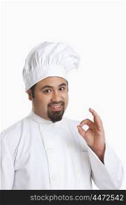Portrait of chef giving ok hand gesture