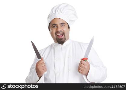 Portrait of chef holding knives