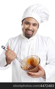 Portrait of chef mixing chocolate in a bowl