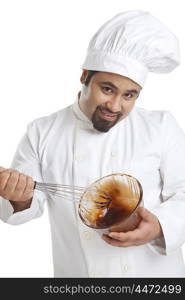 Portrait of chef mixing chocolate in a bowl