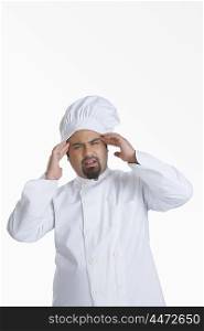Portrait of chef with headache