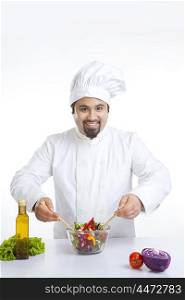 Portrait of chef with vegetables in bowl