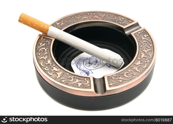 portrait of child and cigarette in ashtray