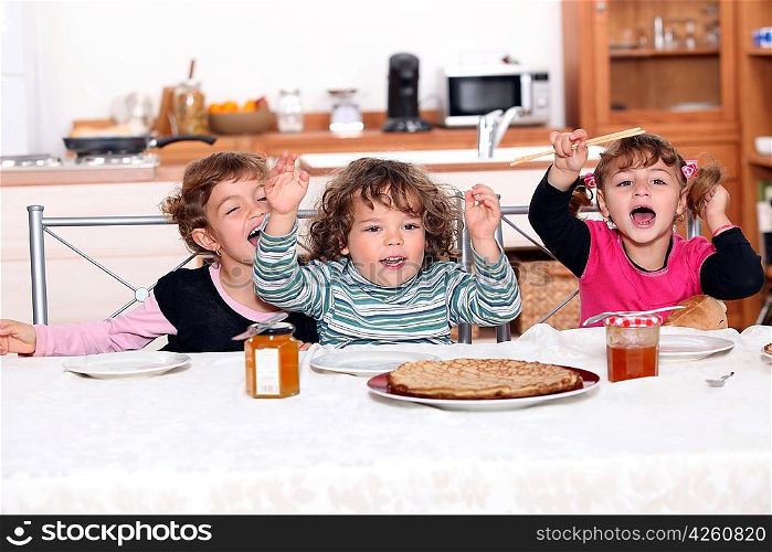 portrait of children eating at table