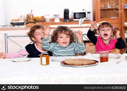 portrait of children eating at table