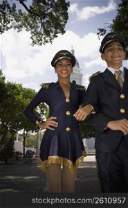 Portrait of children in pilot and flight attendant costumes in center plaza, outdoors
