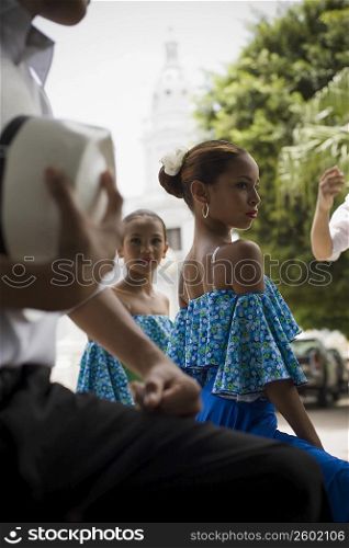 Portrait of children in traditional Plena attire, outdoors
