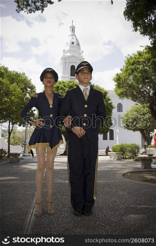 Portrait of children wearing pilot and flight attendant costume