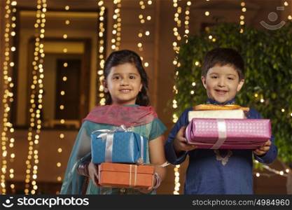 Portrait of children with gifts