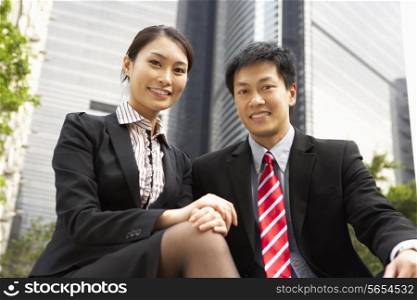 Portrait Of Chinese Businessman And Businesswoman Outside Office