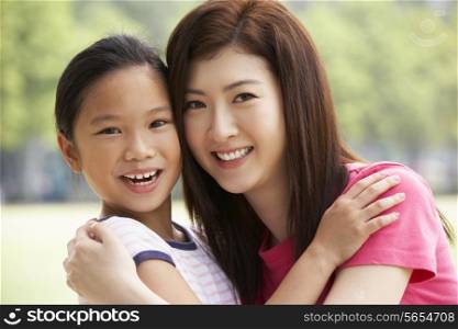 Portrait Of Chinese Mother With Daughter In Park