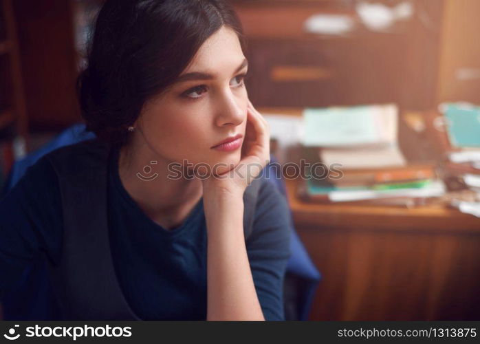 Portrait of clever young woman thinking alone. Knowledge, education, thinking and studying concept.