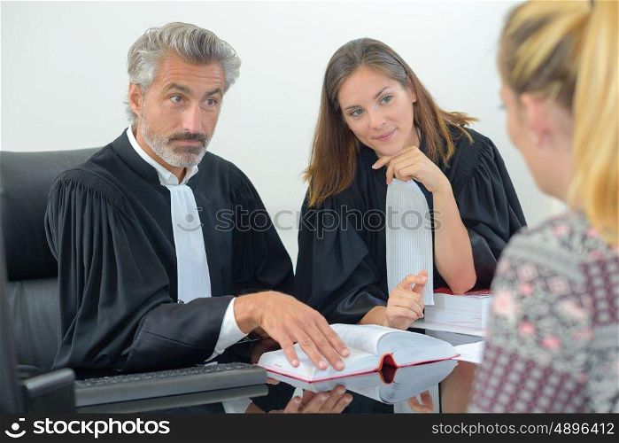 portrait of client with legal professionals