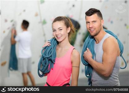 portrait of climbing couple carrying ropes