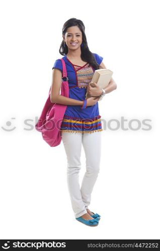 Portrait of college girl with book smiling