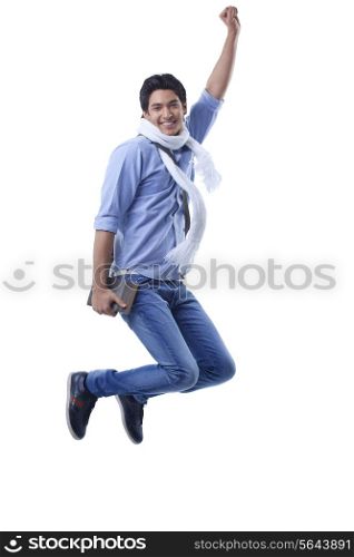 Portrait of college student jumping over white background