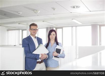 Portrait of confident business people standing in office