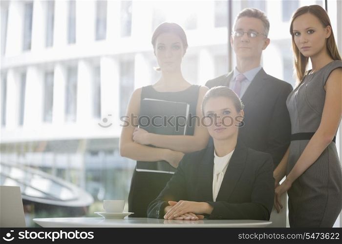 Portrait of confident business team in office cafeteria