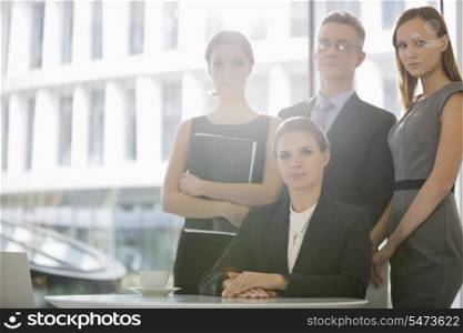 Portrait of confident business team in office cafeteria