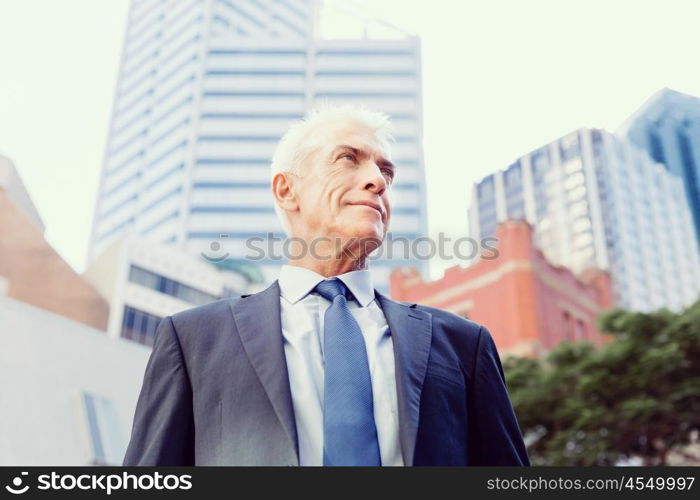 Portrait of confident businessman outdoors. Portrait of confident businessman in suit outdoors