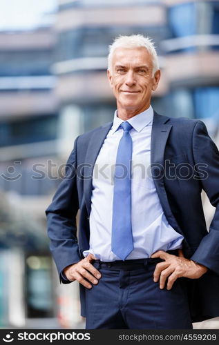 Portrait of confident businessman outdoors. Portrait of confident businessman in suit outdoors