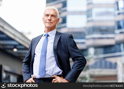 Portrait of confident businessman outdoors. Portrait of confident businessman in suit outdoors