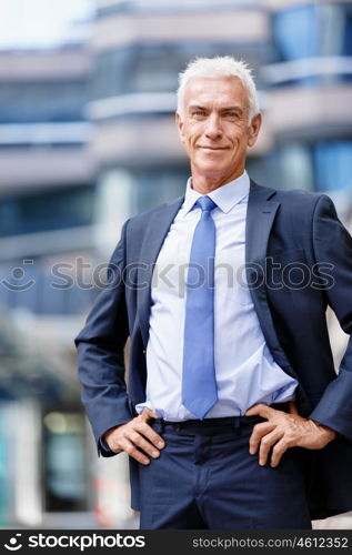 Portrait of confident businessman outdoors. Portrait of confident businessman in suit outdoors