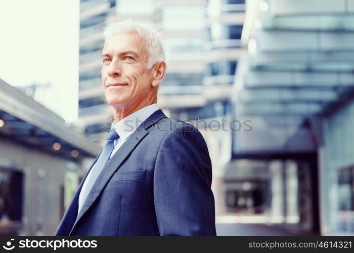 Portrait of confident businessman outdoors. Portrait of confident businessman in suit outdoors