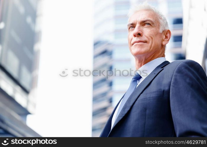 Portrait of confident businessman outdoors. Portrait of confident businessman in suit outdoors