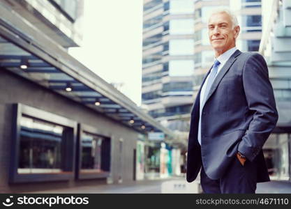 Portrait of confident businessman outdoors. Portrait of confident businessman in suit outdoors