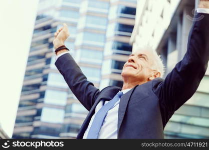 Portrait of confident businessman outdoors. Portrait of confident businessman in suit outdoors