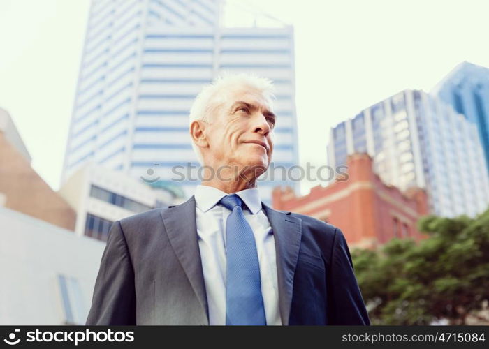 Portrait of confident businessman outdoors. Portrait of confident businessman in suit outdoors