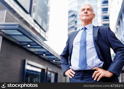 Portrait of confident businessman outdoors. Portrait of confident businessman in suit outdoors