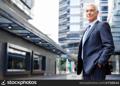 Portrait of confident businessman outdoors. Portrait of confident businessman in suit outdoors