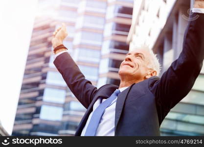 Portrait of confident businessman outdoors. Portrait of confident businessman in suit outdoors