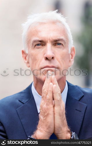 Portrait of confident businessman outdoors. Portrait of confident businessman in suit outdoors