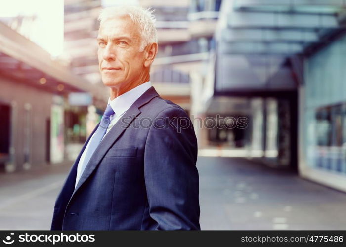 Portrait of confident businessman outdoors. Portrait of confident businessman in suit outdoors