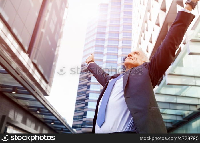 Portrait of confident businessman outdoors. Portrait of confident businessman in suit outdoors