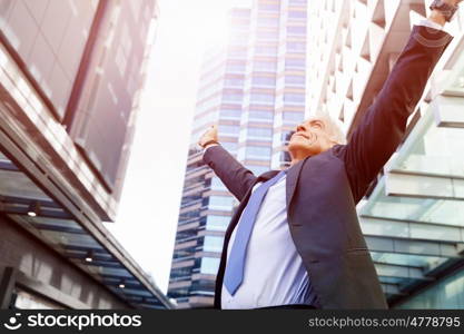 Portrait of confident businessman outdoors. Portrait of confident businessman in suit outdoors