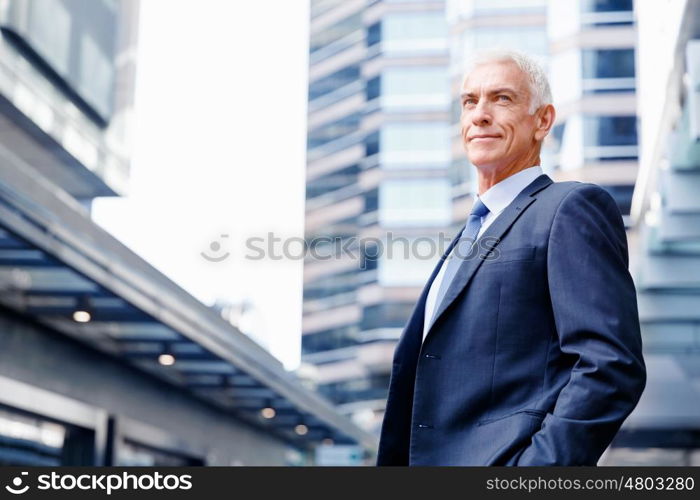 Portrait of confident businessman outdoors. Portrait of confident businessman in suit outdoors