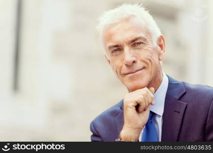 Portrait of confident businessman outdoors. Portrait of confident businessman in suit outdoors