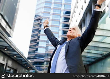 Portrait of confident businessman outdoors. Portrait of confident businessman in suit outdoors