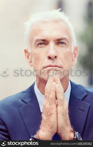 Portrait of confident businessman outdoors. Portrait of confident businessman in suit outdoors