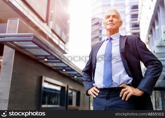 Portrait of confident businessman outdoors. Portrait of confident businessman in suit outdoors