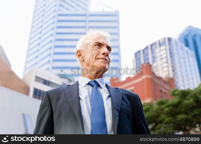 Portrait of confident businessman outdoors. Portrait of confident businessman in suit outdoors